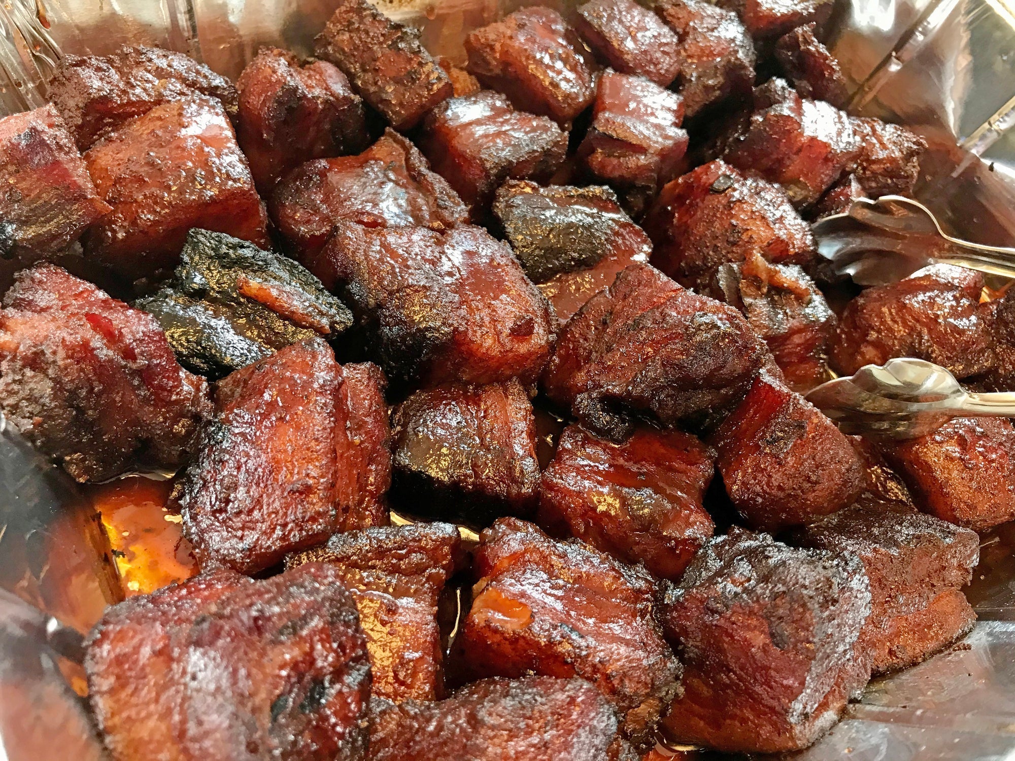 Smoked pork belly burnt ends coated in honey bourbon glaze